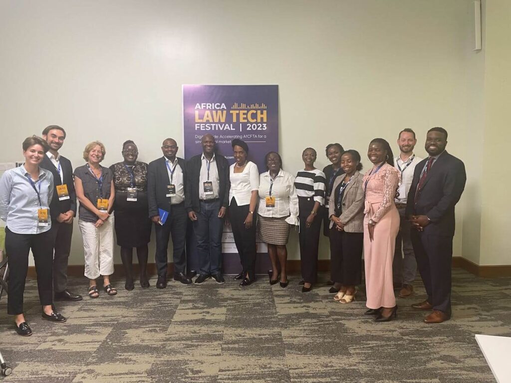 a group of people in front of a sign reading "Africa Law Tech Festival 2023"