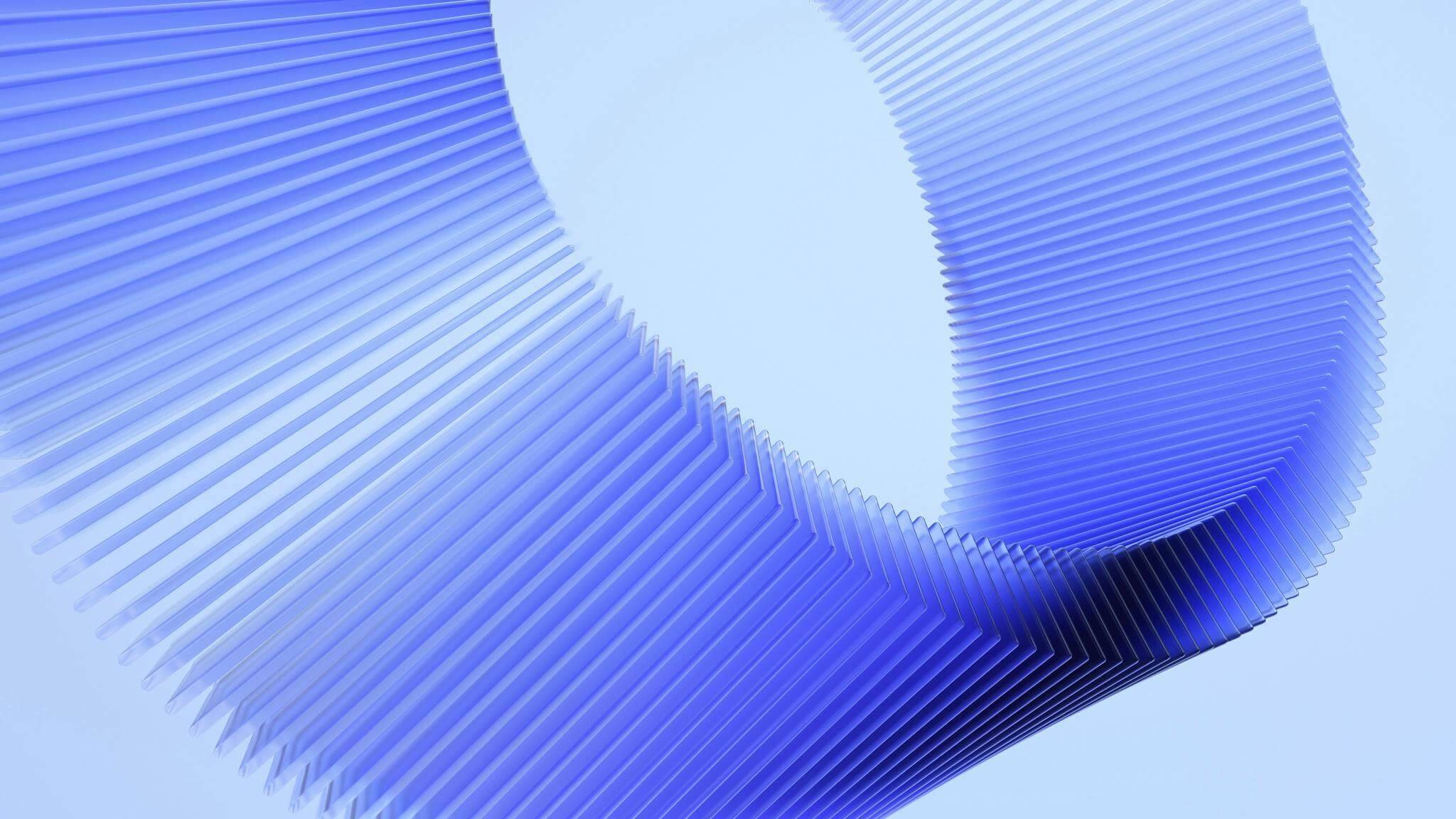 A blue circular 3d object on a light blue background