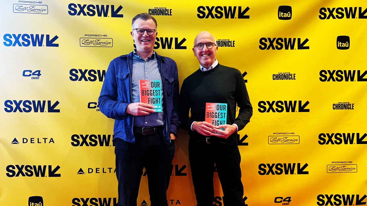 Photo of Frank McCourt, Executive Chairman of McCourt Global and Founder of Project Liberty, along with co-writer Michael Casey, promoting the book OUR BIGGEST FIGHT: Reclaiming Liberty, Humanity, and Dignity in the Digital Age at SXSW in 2024.